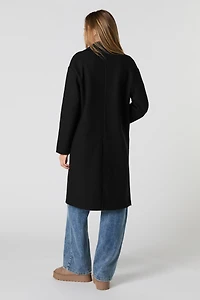 Manteau longueur midi à un bouton