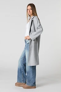 Manteau longueur midi à un bouton