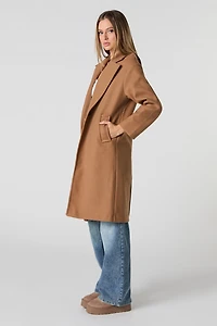 Manteau longueur midi à un bouton