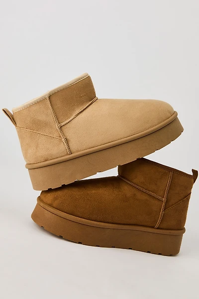 Bottilons aux chevilles à semelle plateforme en similisuède