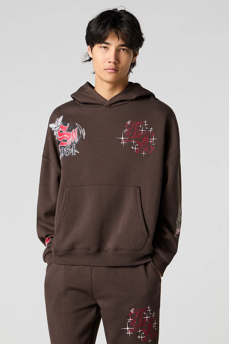 Haut à capuchon en molleton broderie LA