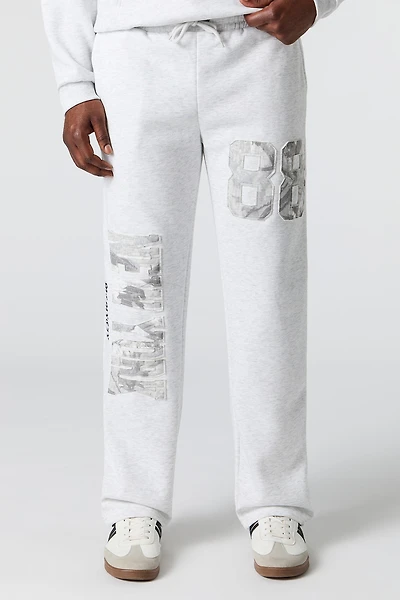 Pantalon d'entraînement en molleton avec empiècement et motif camouflage