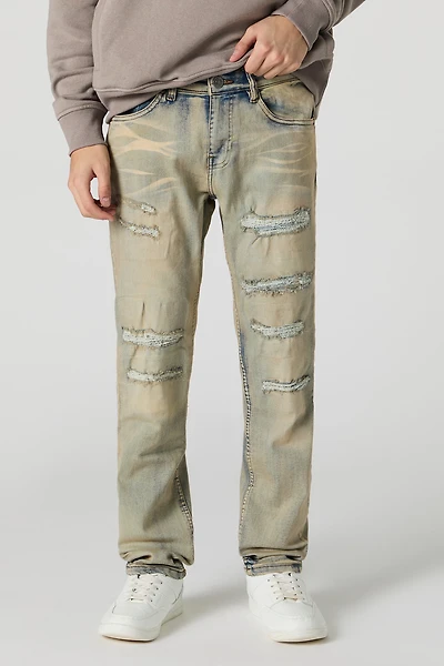 Jean ajusté en denim extensible d'aspect usé