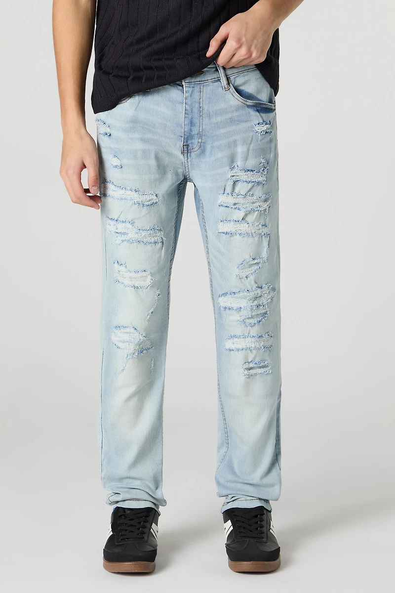 Jean mince en denim extensible d'aspect usé délavé pâle