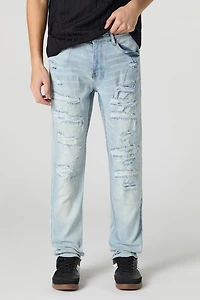 Jean mince en denim extensible d'aspect usé délavé pâle