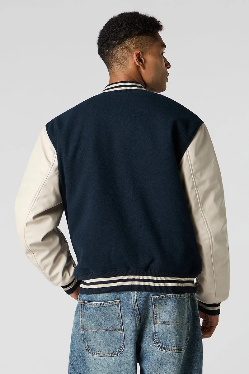 Blouson de style universitaire en molleton avec manches similicuir