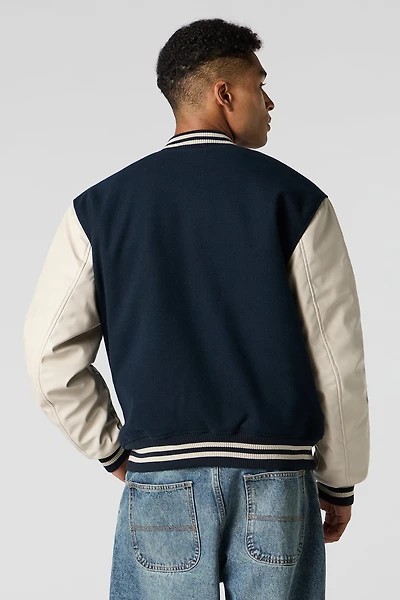 Blouson de style universitaire en molleton avec manches similicuir