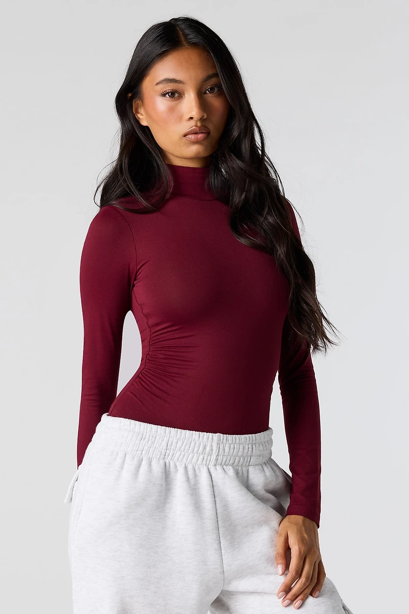 Maillot profilé cintré à col cheminée