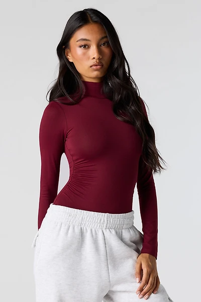 Maillot profilé cintré à col cheminée