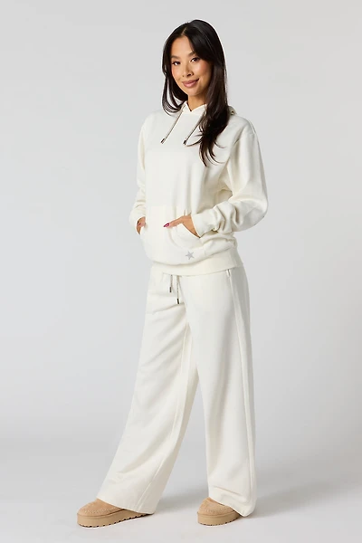 Pantalon d'entraînement à jambe large en molleton avec imprimé Étoile