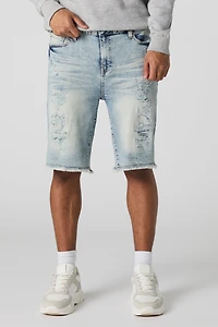 Short en denim d'aspect usé avec franges