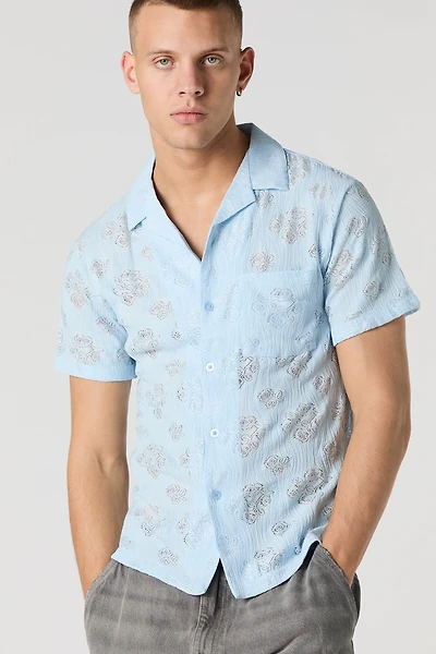 Haut boutonné en tricot de pointelle fleuri