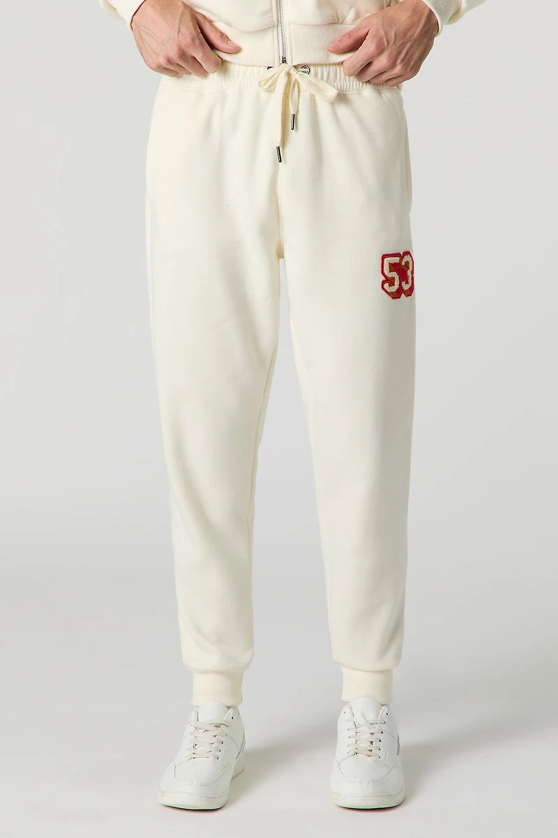 Haut à capuchon avec motif brodé 53 en chenille et fermeture glissière