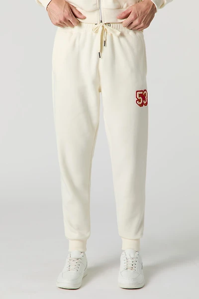 Haut à capuchon avec motif brodé 53 en chenille et fermeture glissière