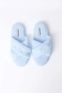 Pantoufles en bouclée pelucheuse croisées avec broderie