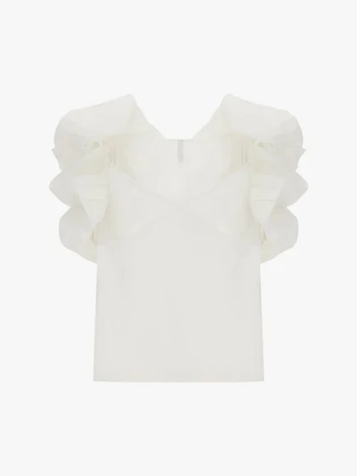 Sleeveless top sculptural ruffled shoulders