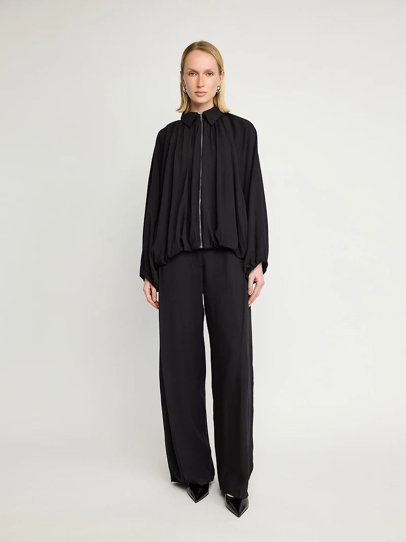 Veste zippée drapée à manches chauve-souris