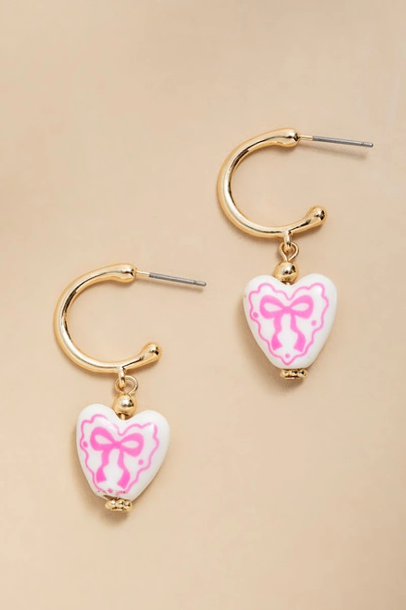 Sharon Bow On Ceramic Heart Huggie Earrings