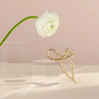 THE HAIR EDIT Gilded Bow Claw Clip