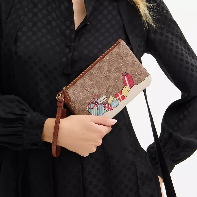 Essential Small Wristlet In Signature Canvas With Holiday Gifts