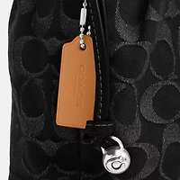 Faye Mini Drawstring Bag In Signature Denim