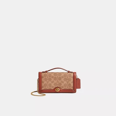 Restored Riley Chain Clutch In Colorblock Signature Canvas