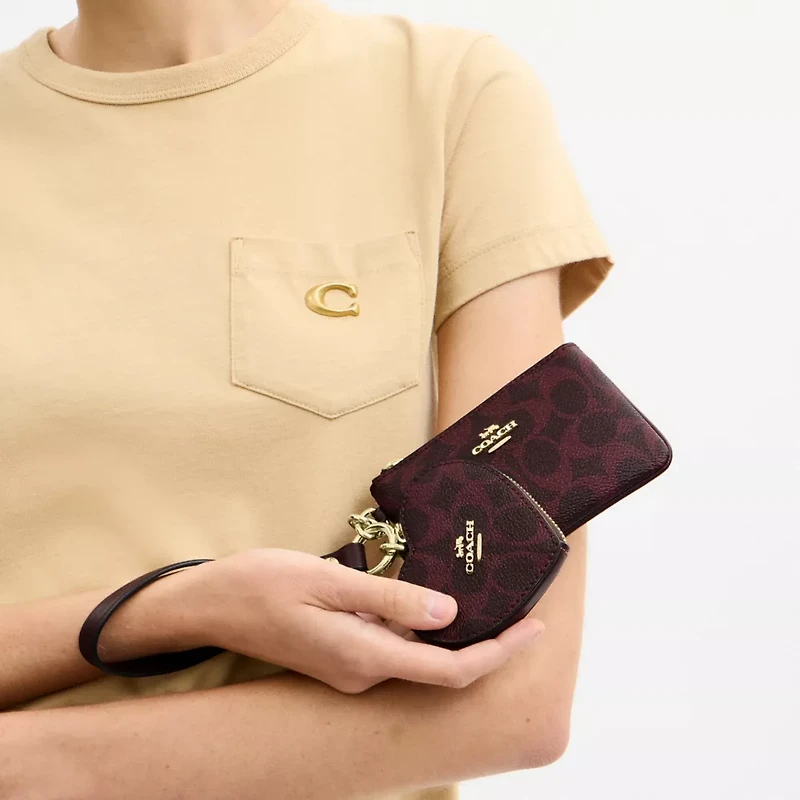 Wristlet And Heart Pouch In Signature Canvas