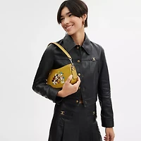 Disney X Coach Swinger Bag In Regenerative Leather With Mickey Mouse And Friends