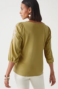 floral-embroidered top