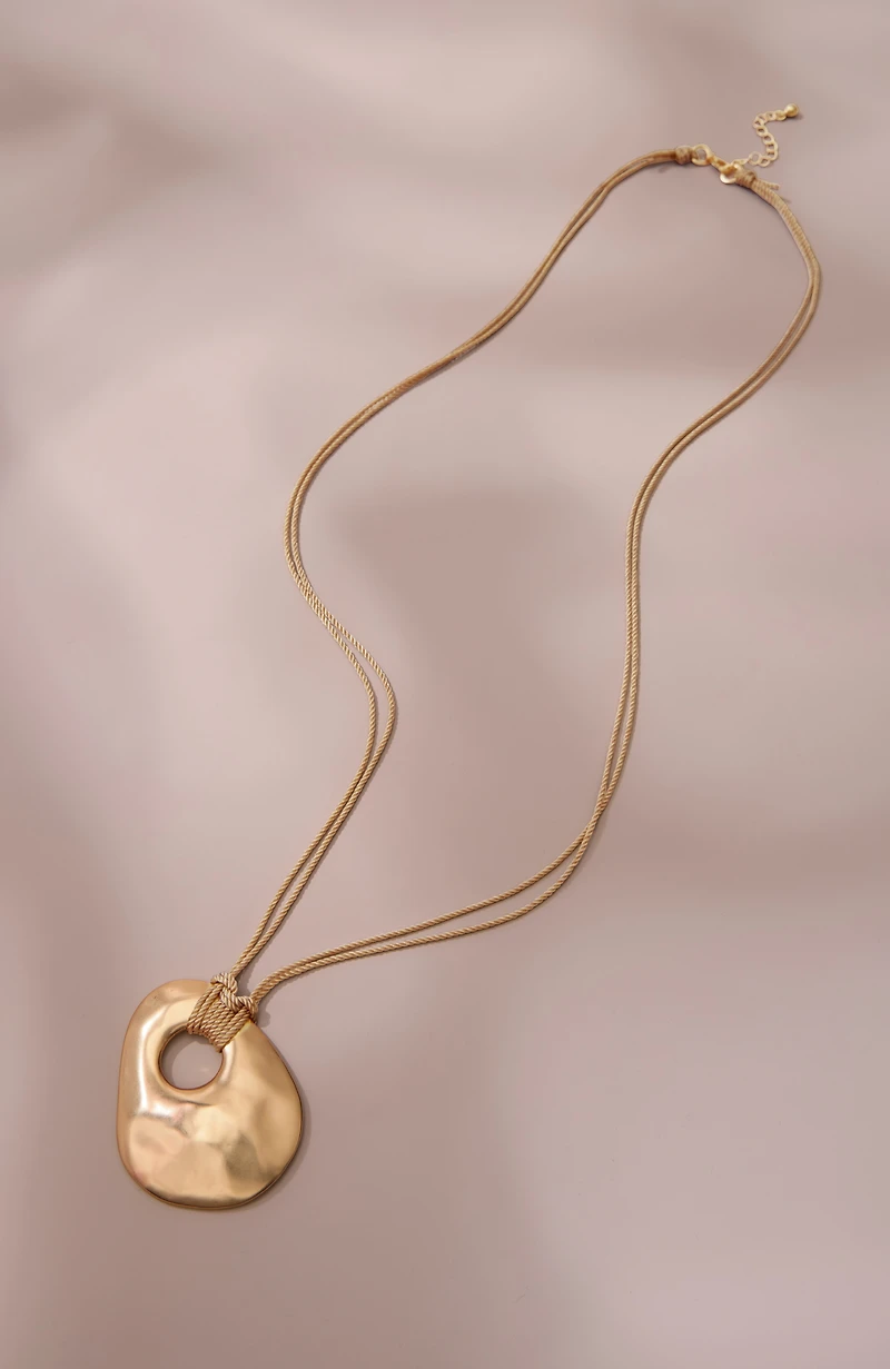 artisanal metal pendant