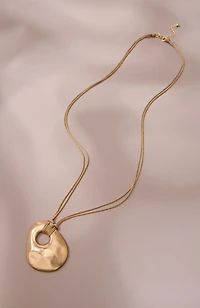 artisanal metal pendant