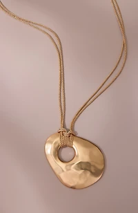 artisanal metal pendant
