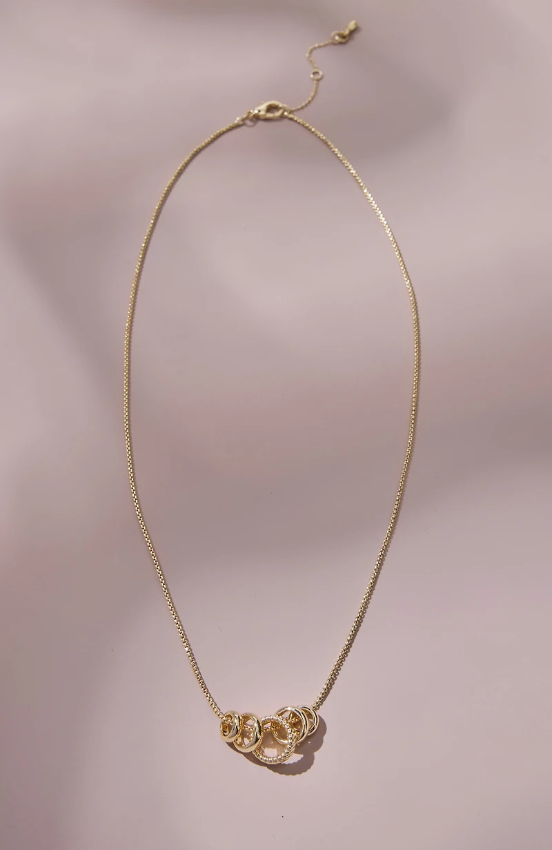 compassion fund five golden rings necklace