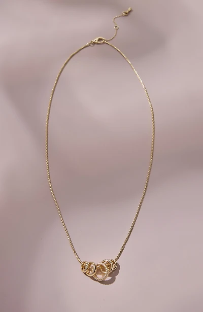compassion fund five golden rings necklace