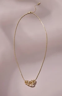 compassion fund five golden rings necklace