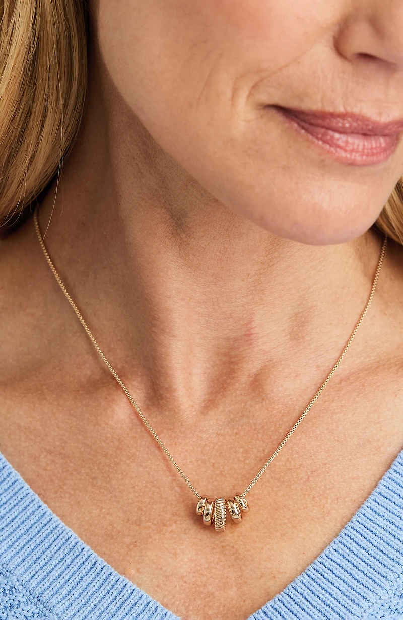 compassion fund five golden rings necklace