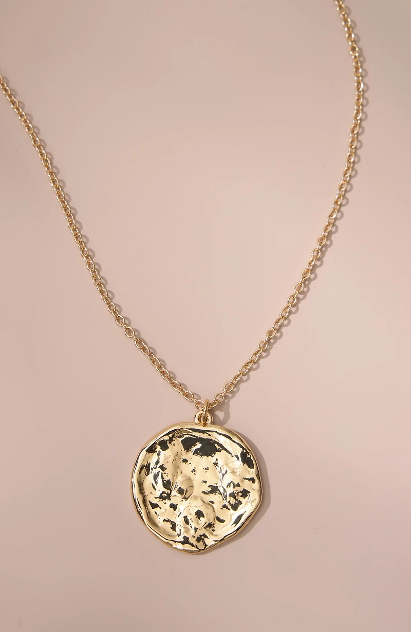 hammered coin pendant