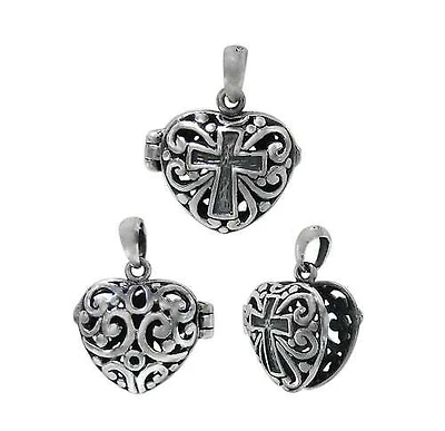 Sterling Silver, Heart Shape Locket With Cross And Filigree Design. Approx Size: 15mm L X 15mm W X 7.5mm T