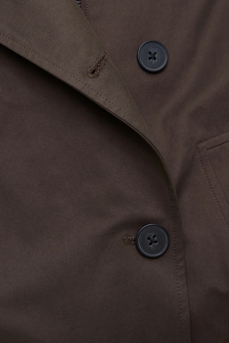 Manteau asymétrique en twill à boutons