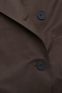 Manteau asymétrique en twill à boutons