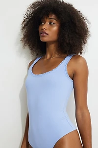 Justaucorps côtelé à bordure volants