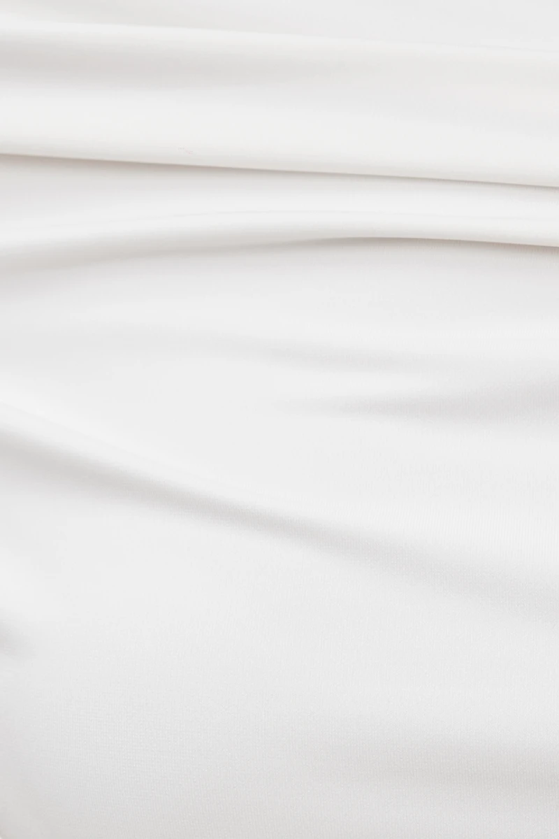 Haut sculptant orné d'une boucle