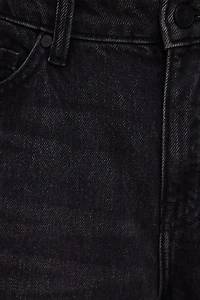 Jean Mika à taille mi-haute et jambe droite décontractée