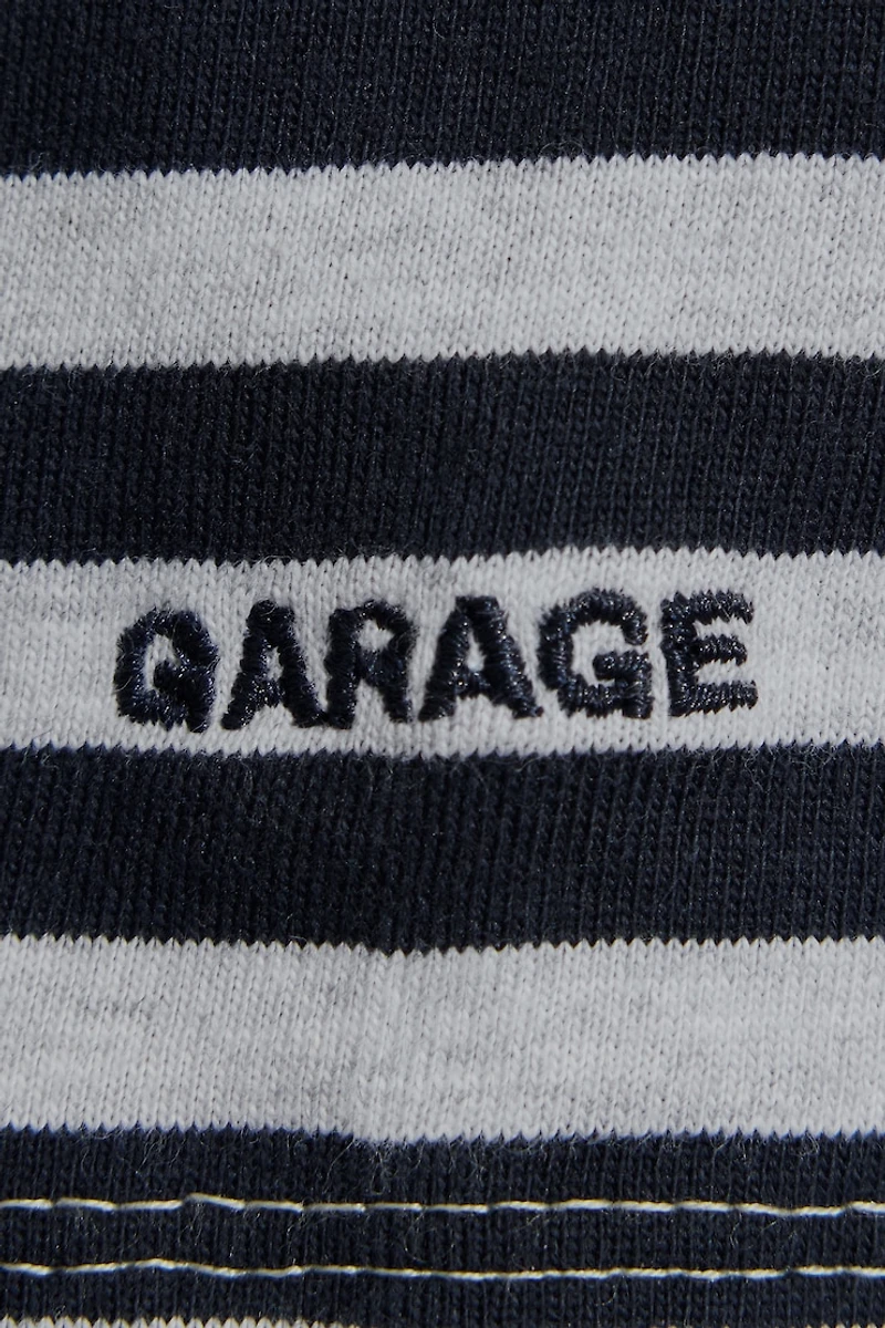 Haut écourté fluide à col rond et manches longues