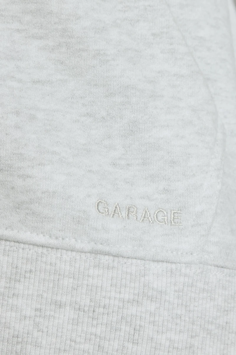 Haut à capuchon zippé emblématique en SoftTerry