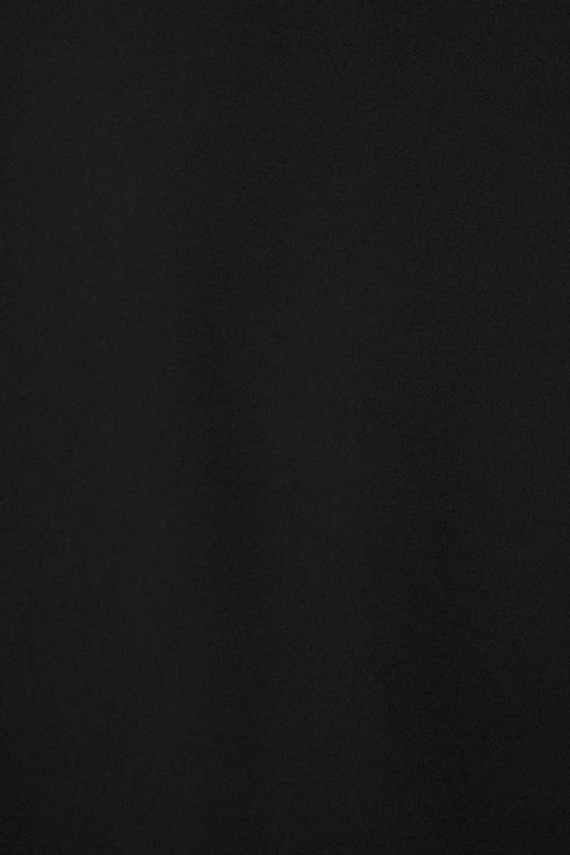 Haut semi-diaphane ouvert à volants