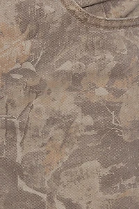 Pantalon camouflage ample à taille basse