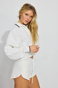 T-shirt style polo ample et écourté