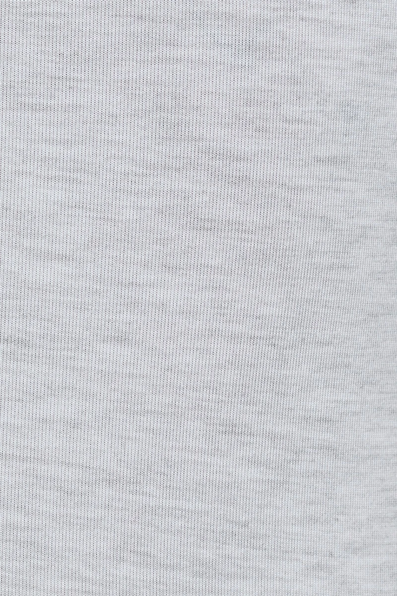 Haut torsadé asymétrique à manches courtes