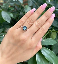 10K White Gold 7x5mm Pear Cut Sky Blue Topaz with Blue Sapphire Halo and 0.10cttw Diamond Ring - 4.5